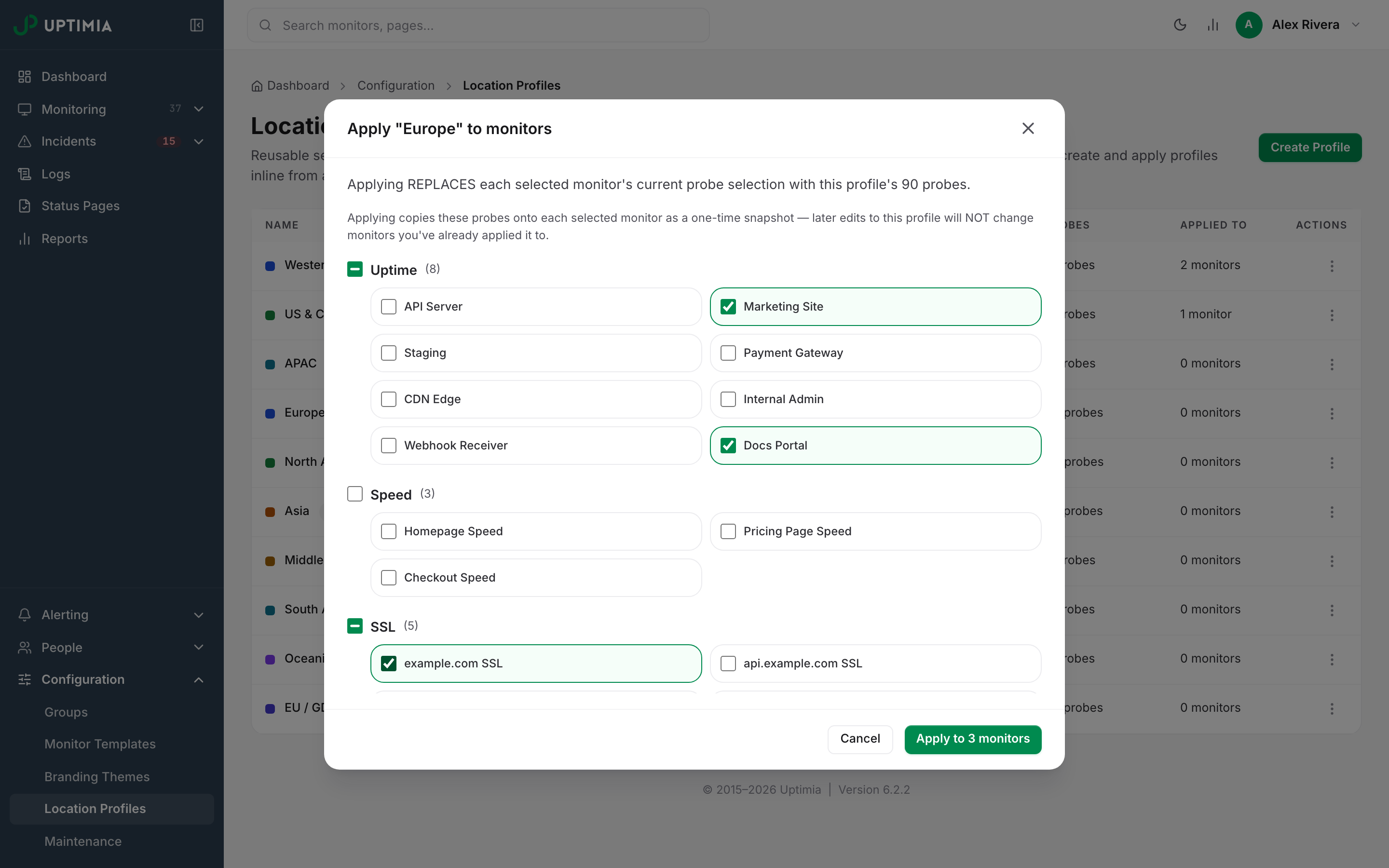 The bulk-apply modal for the Europe profile, with monitors grouped by family and per-group select-all checkboxes.