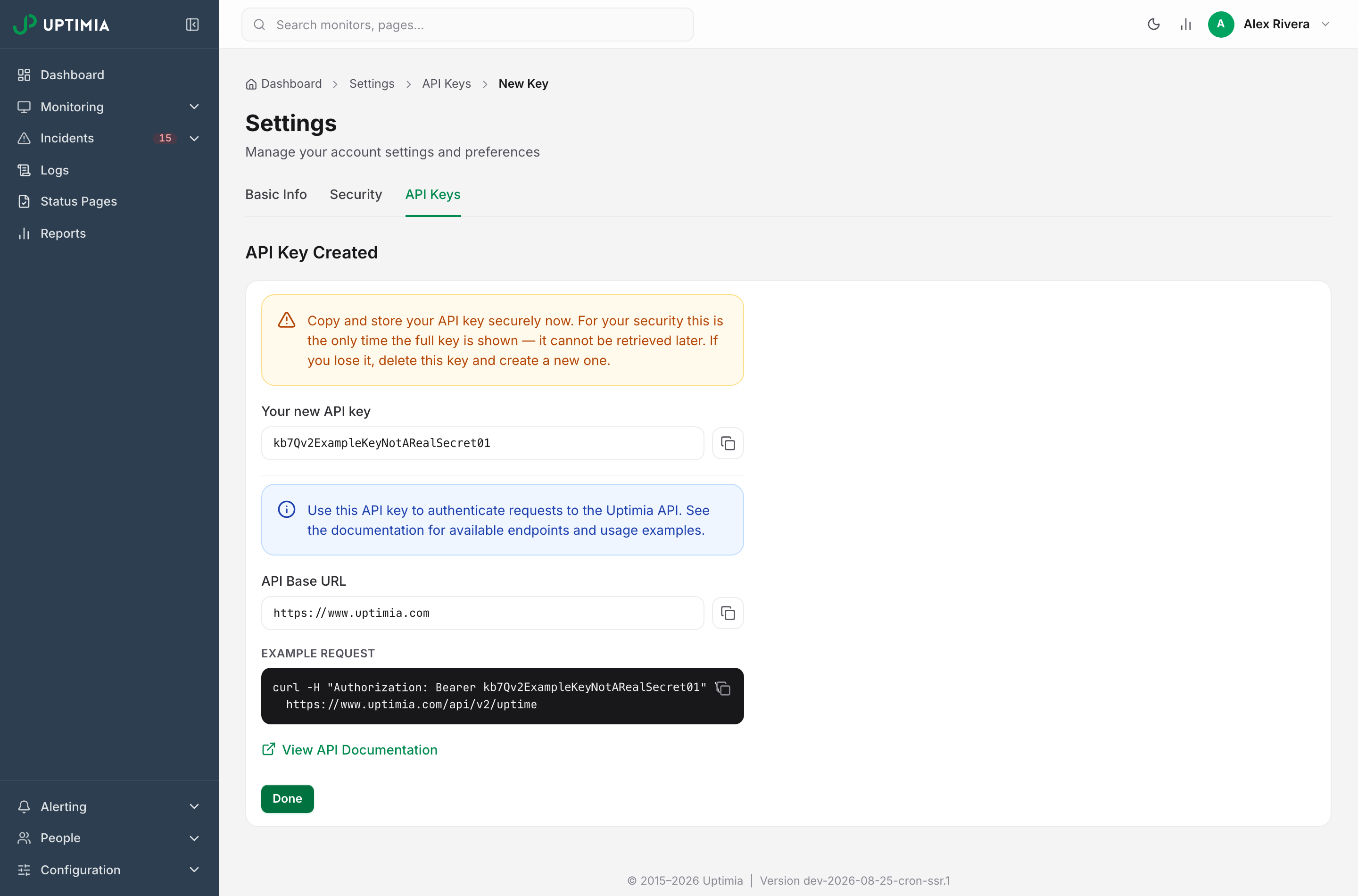 The API Key Created screen, showing the one-time full key above the API base URL and a ready-made example request.